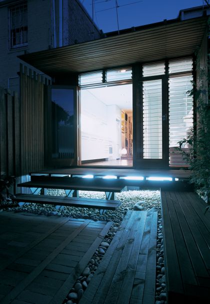 H House exterior rear at dusk with concealed lighting