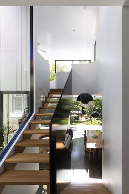 Unfurled House interior stair view to ground and first floors