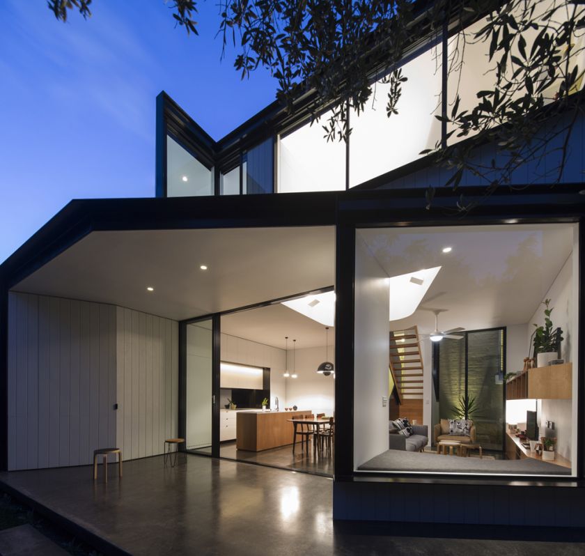 Unfurled House exterior dusk view of rear