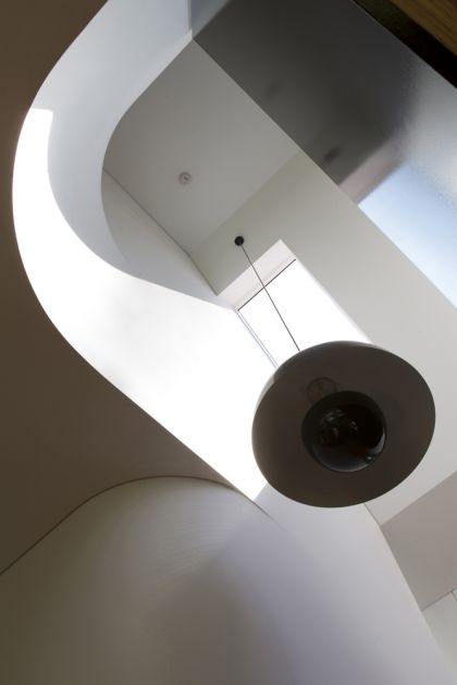 Unfurled House interior view up stair void