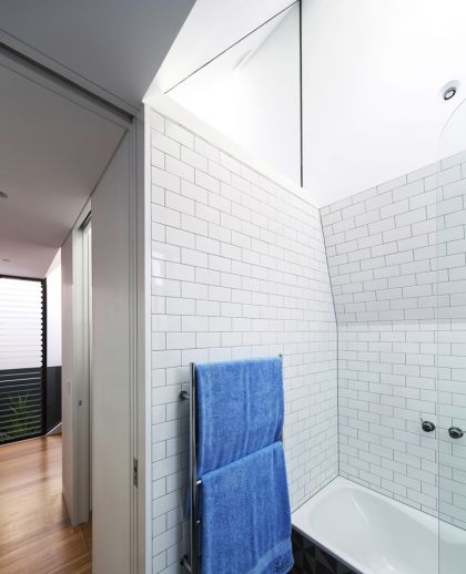 Unfurled House interior view of folded ceiling and hall to courtyard