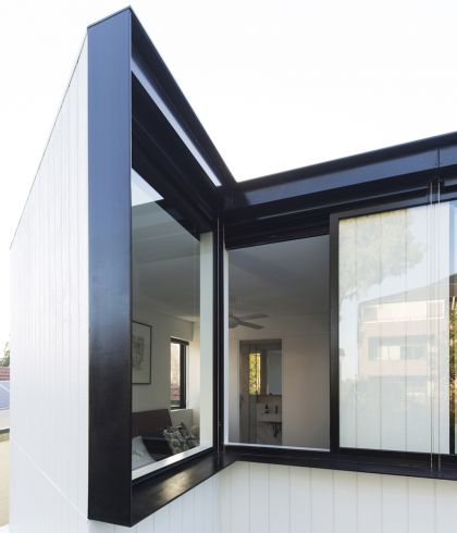 Unfurled House interior view of upper bedroom projecting wedge