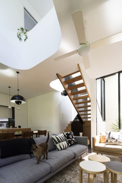 Unfurled House view of living space, stair and void to upper floor