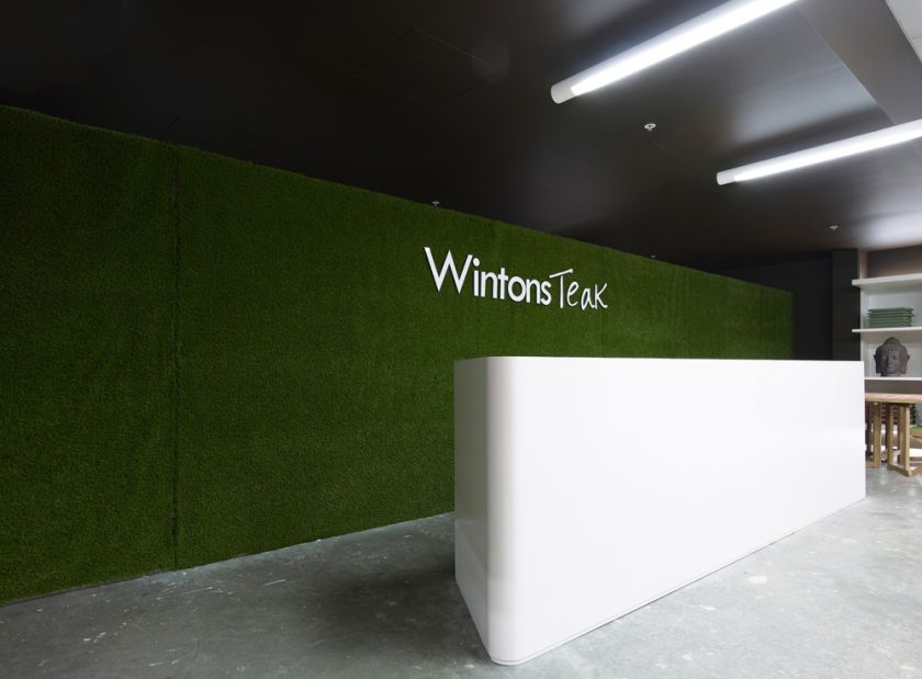 Wintons Teak Showroom sales counter joinery & operable turf wall