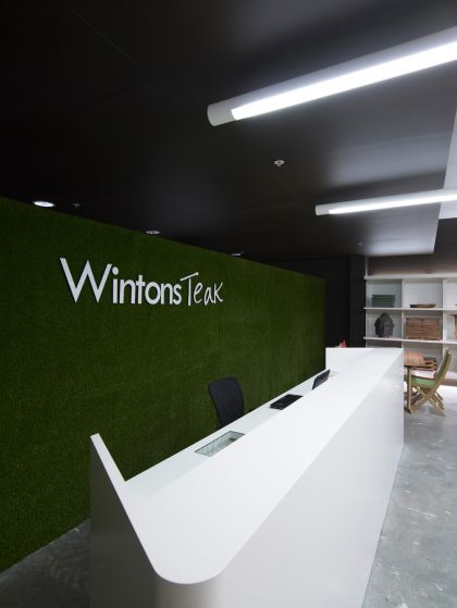 Wintons Teak Showroom sales counter joinery & operable turf wall